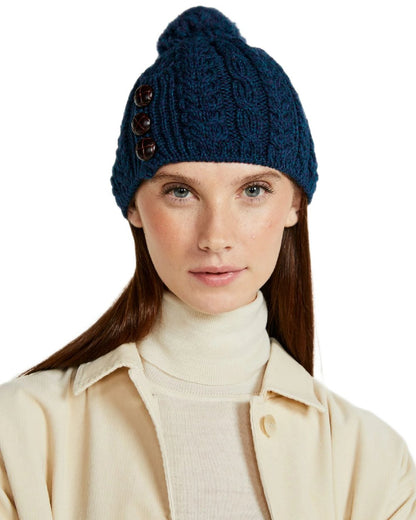 Atlantic Blue Coloured Aran Womens Cong Hat With Pom Pom on white background 
