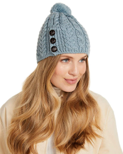 Blue Coloured Aran Womens Cong Hat With Pom Pom on white background 