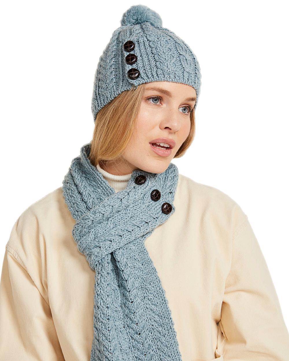 Blue Coloured Aran Womens Cong Hat With Pom Pom on white background 