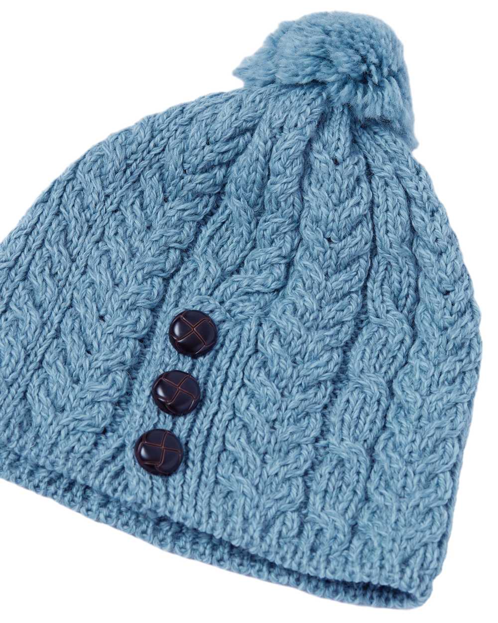 Blue Coloured Aran Womens Cong Hat With Pom Pom on white background 
