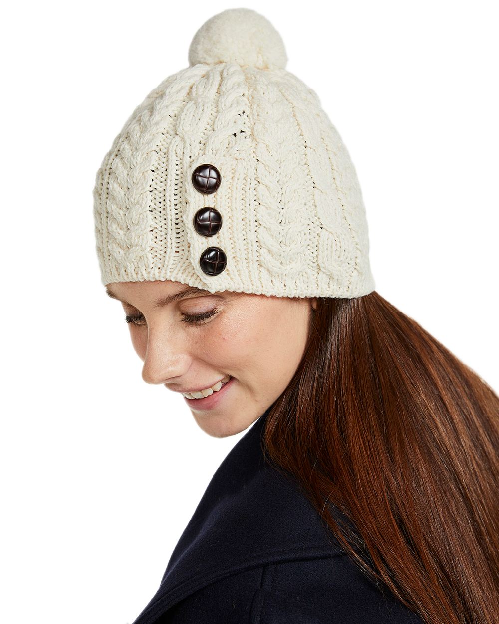 Cream Coloured Aran Womens Cong Hat With Pom Pom on white background 