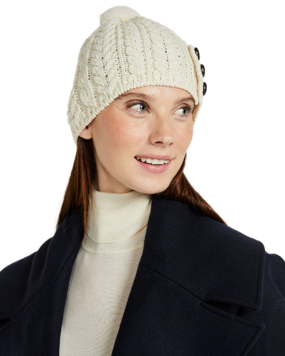 Cream Coloured Aran Womens Cong Hat With Pom Pom on white background 