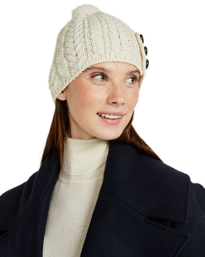 Cream Coloured Aran Womens Cong Hat With Pom Pom on white background 