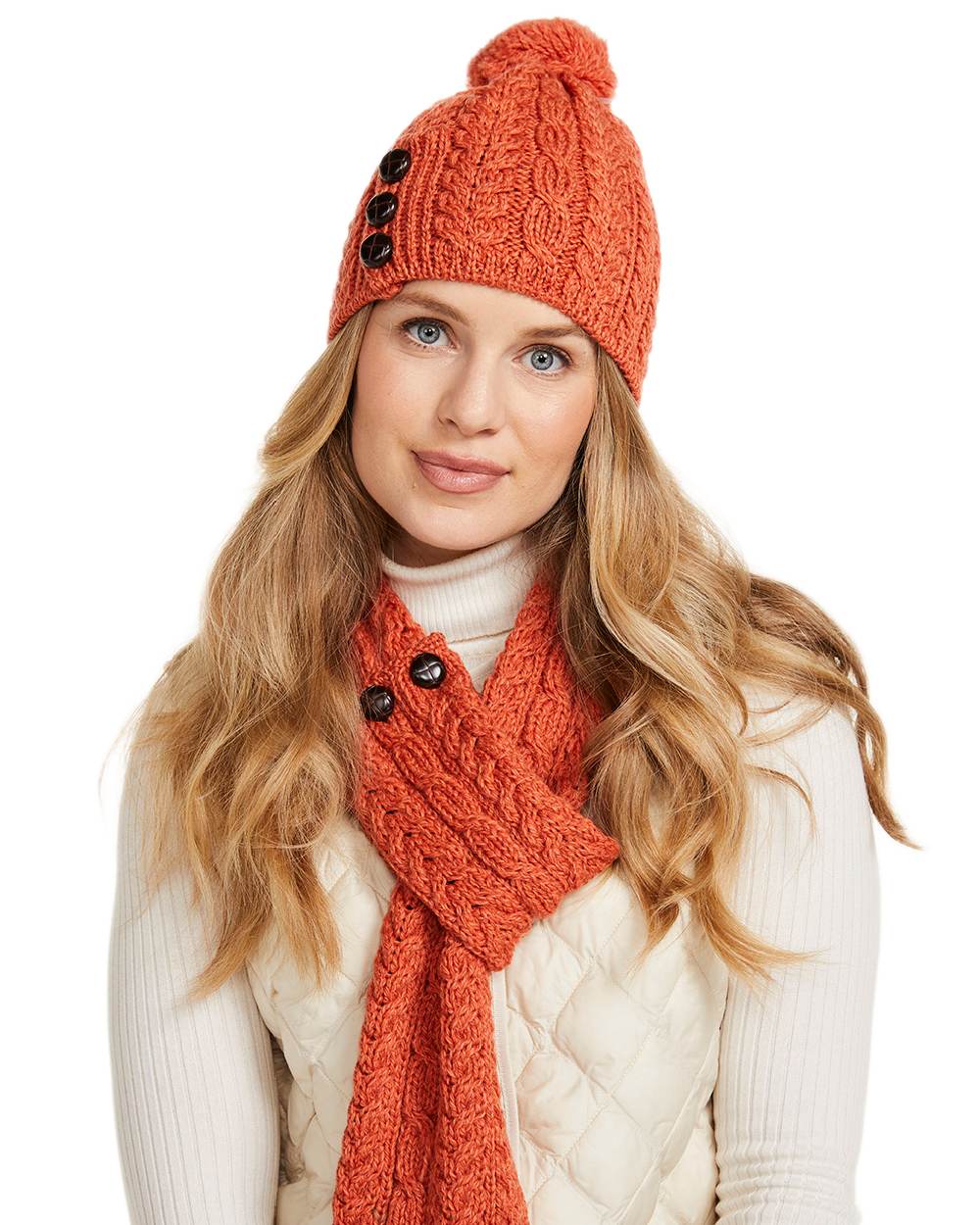 Red Orange Coloured Aran Womens Cong Hat With Pom Pom on white background 