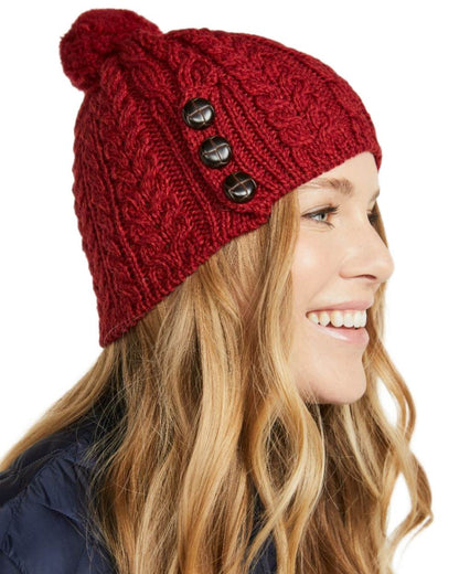 Red Coloured Aran Womens Cong Hat With Pom Pom on white background 