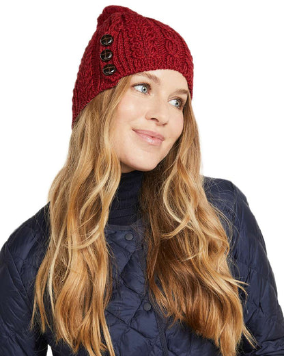 Red Coloured Aran Womens Cong Hat With Pom Pom on white background 