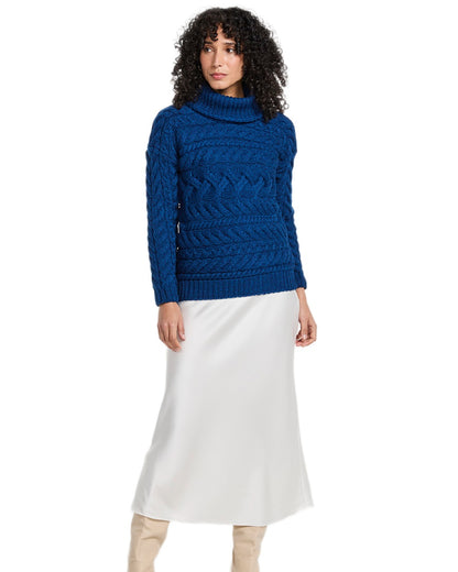 Blue Coloured Aran Womens Derreen Horizontal Cable Sweater on white background 