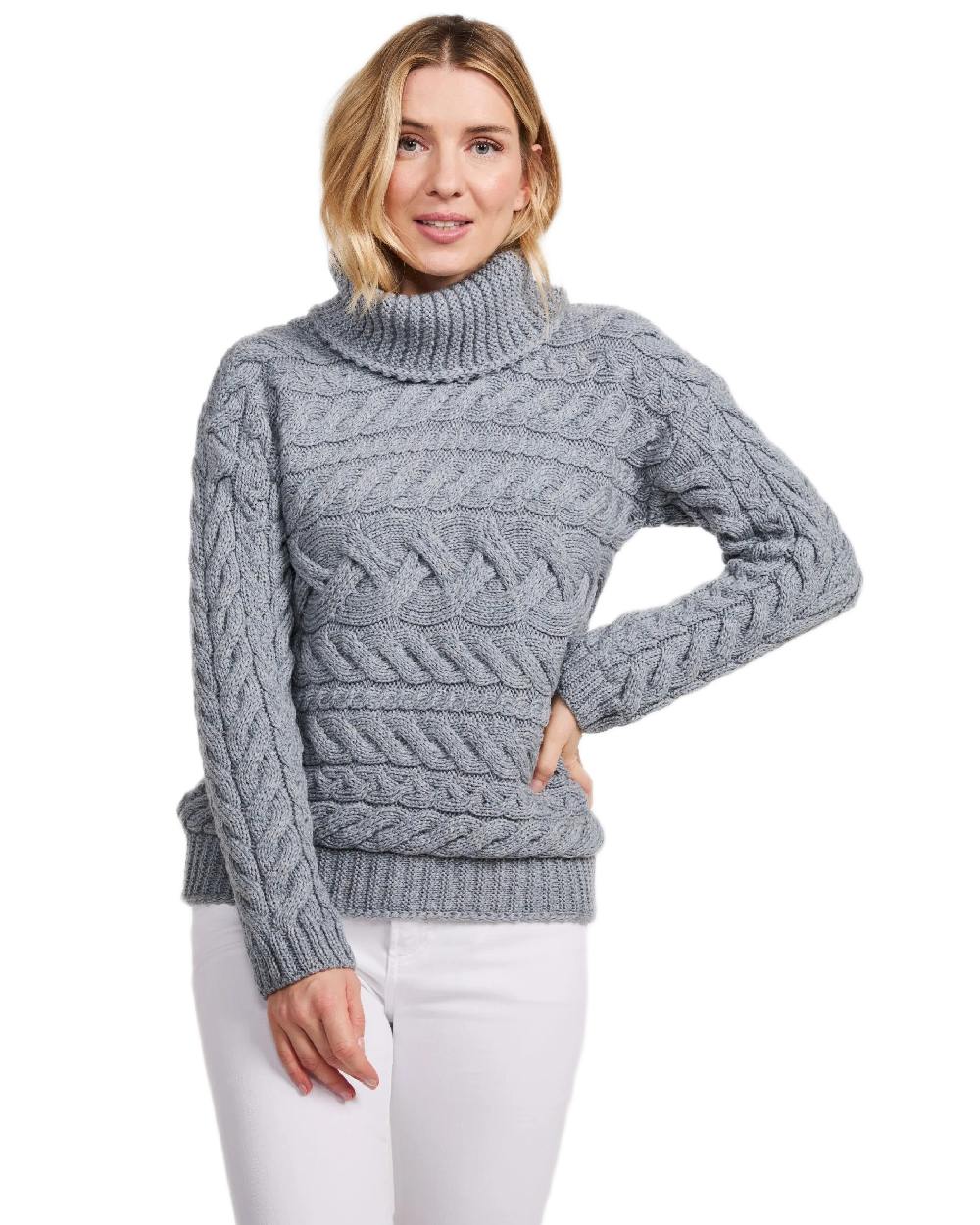 Denim Coloured Aran Womens Derreen Horizontal Cable Sweater on white background 