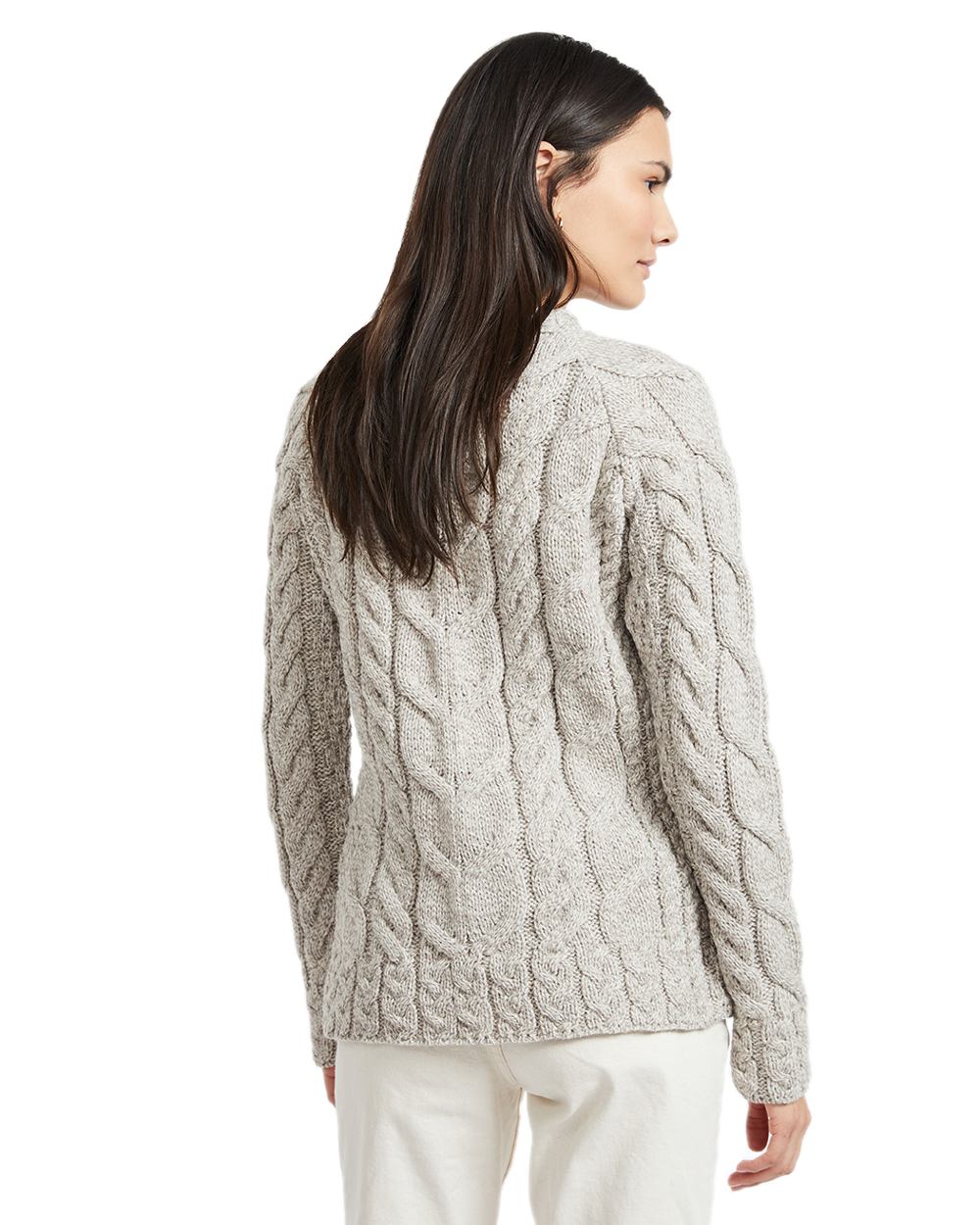 Oat Coloured Aran Womens Listowel Cabled Sweater on curtain background 