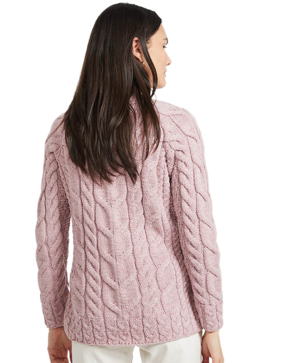 Pink Coloured Aran Womens Listowel Cabled Sweater on curtain background 