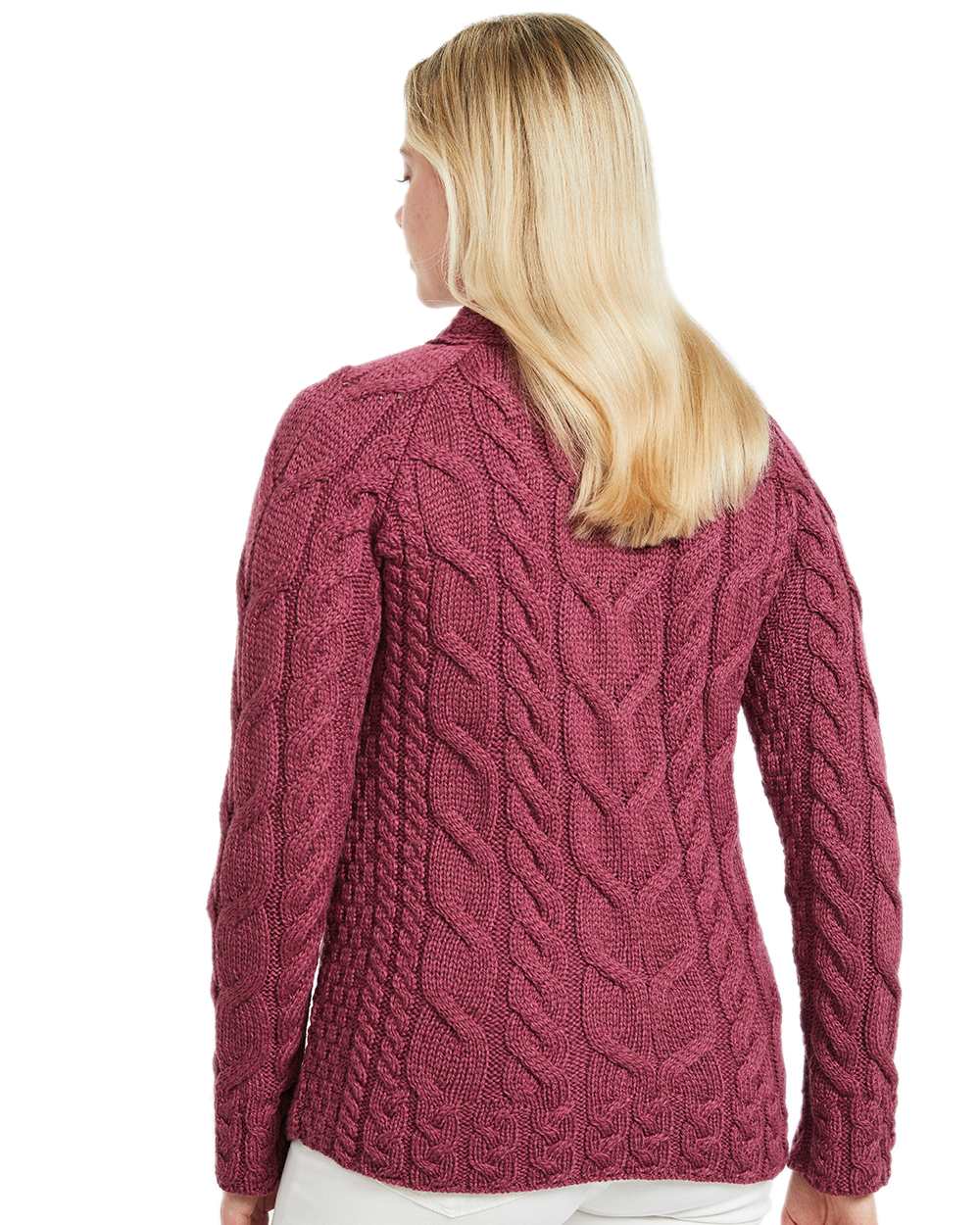 Raspberry Coloured Aran Womens Listowel Cabled Sweater on curtain background 