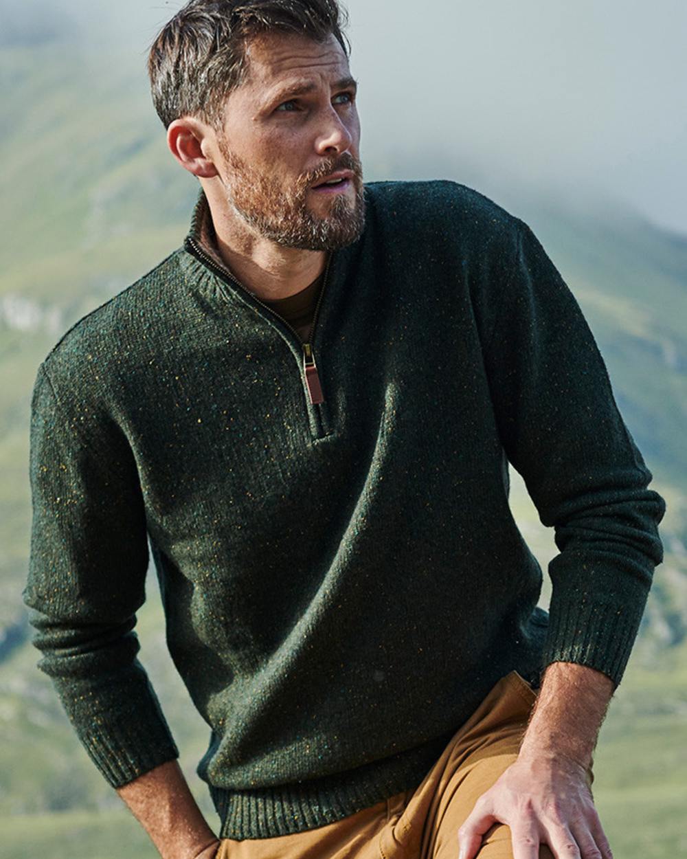 Green Coloured Aran Wool Zip Neck Sweater on mountain background 