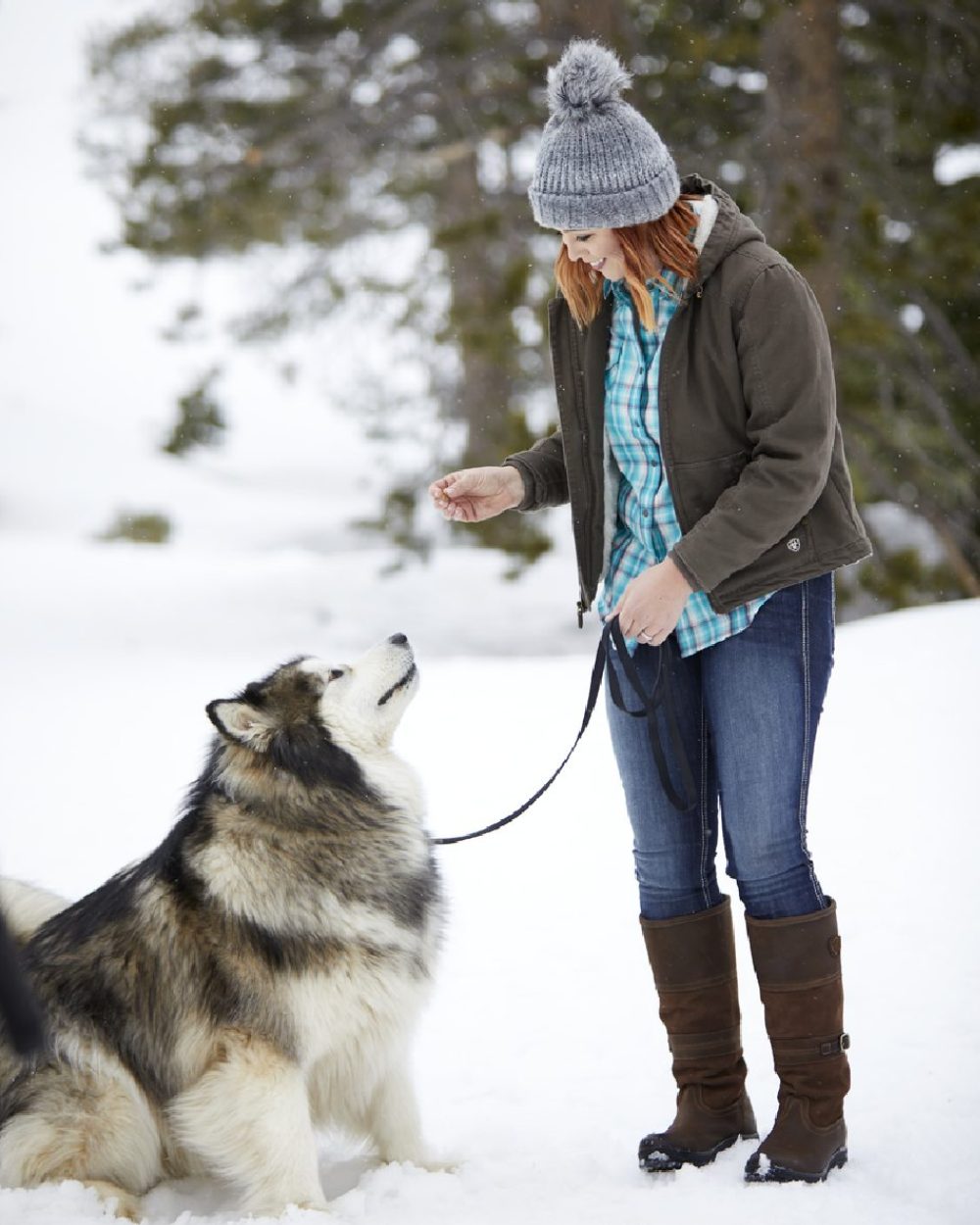 Java coloured Ariat Langdale Waterproof Boots on snow background 