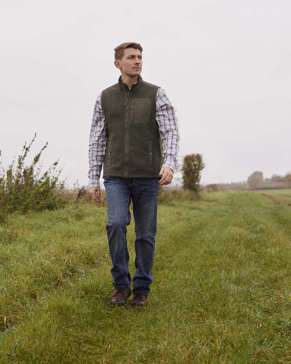 Earth coloured Ariat Mens Millbrae Gilet on field background 