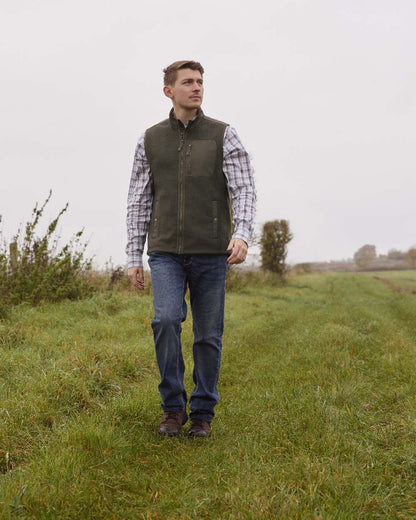 Earth coloured Ariat Mens Millbrae Gilet on field background 