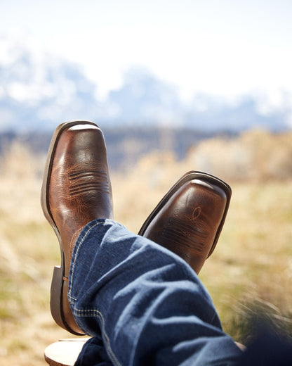 Wicker Coloured Ariat Mens Rambler Western Boots on blurry background 