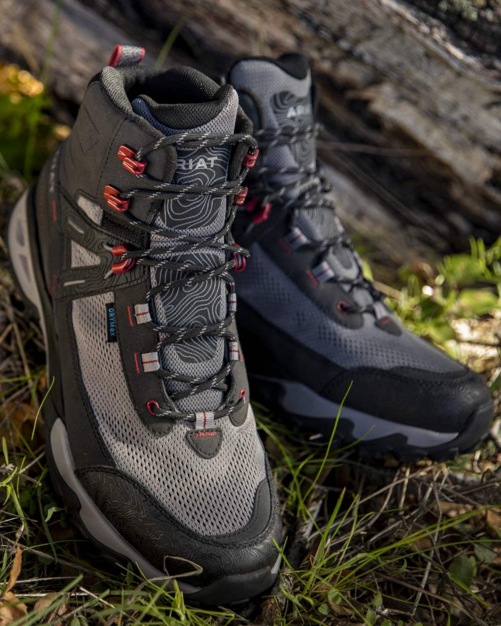 Black Grey coloured Ariat Mens Traverse Mid Waterproof Hiking Boots on outdoor background 