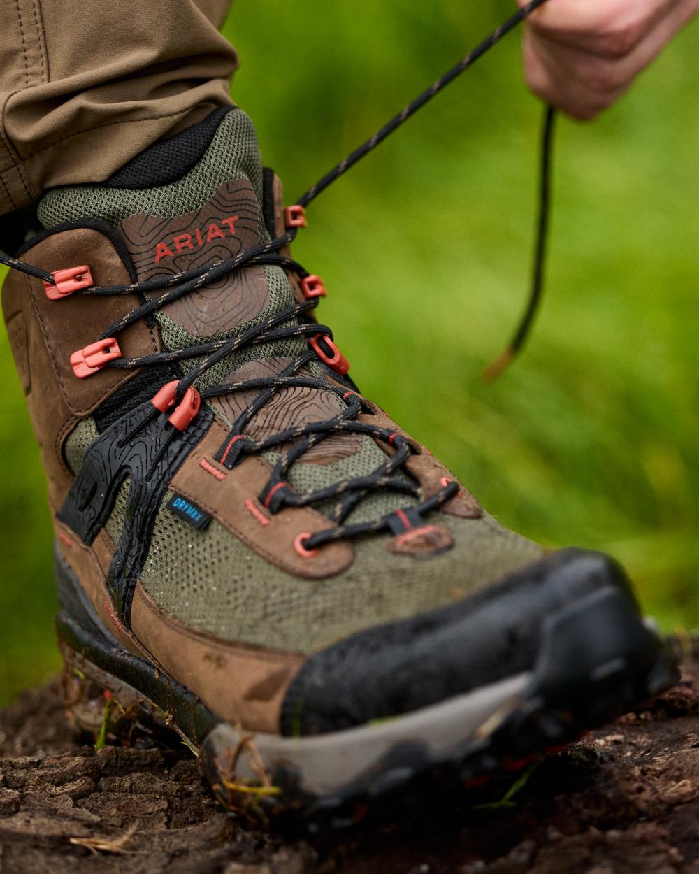 Brown Bark coloured Ariat Mens Traverse Mid Waterproof Hiking Boots on forest background 