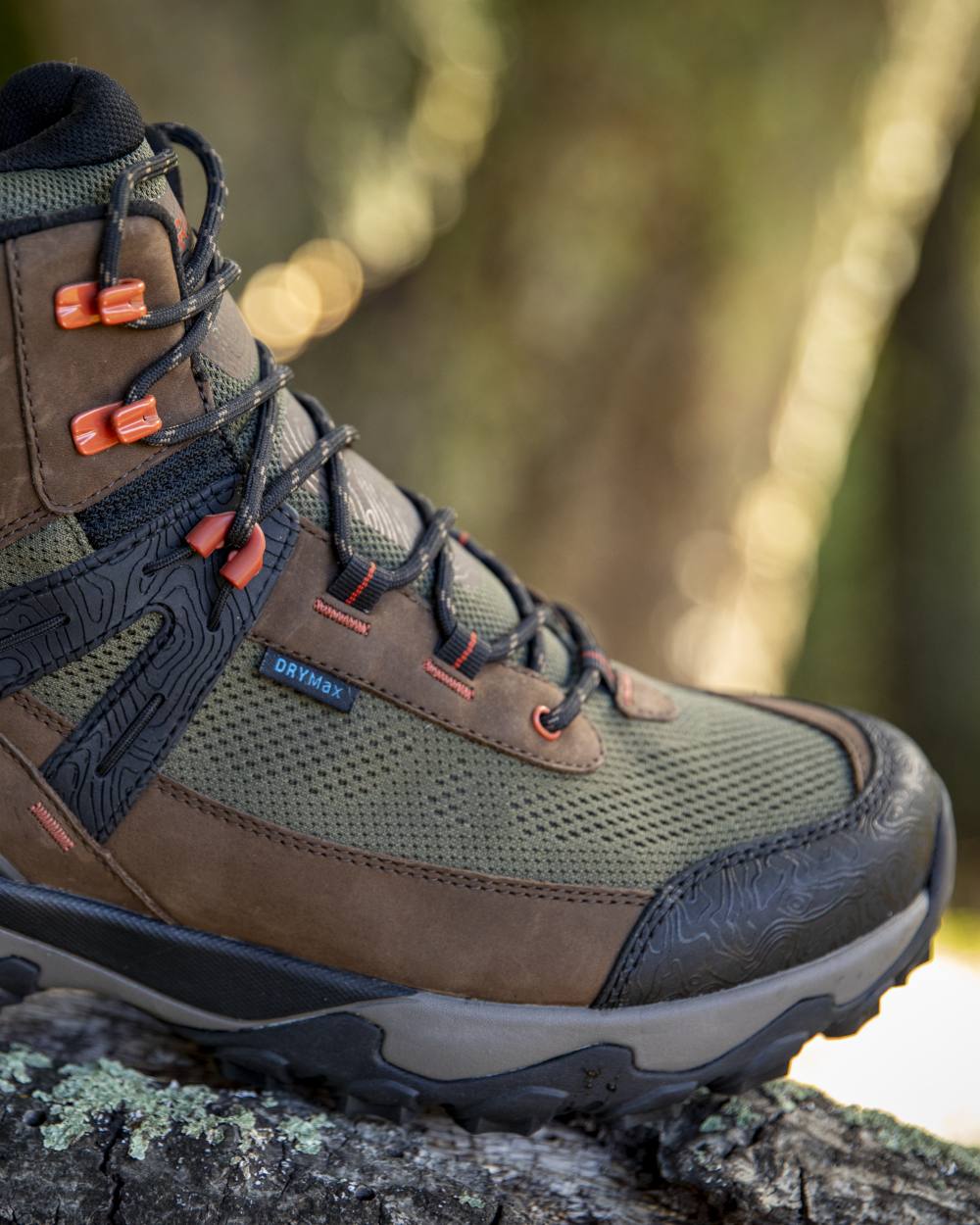 Brown Bark coloured Ariat Mens Traverse Mid Waterproof Hiking Boots on forest background 