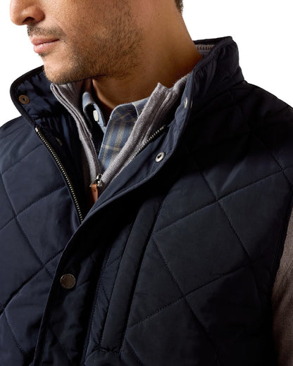 Show Navy coloured Ariat Mens Woodgate Vest on white background 