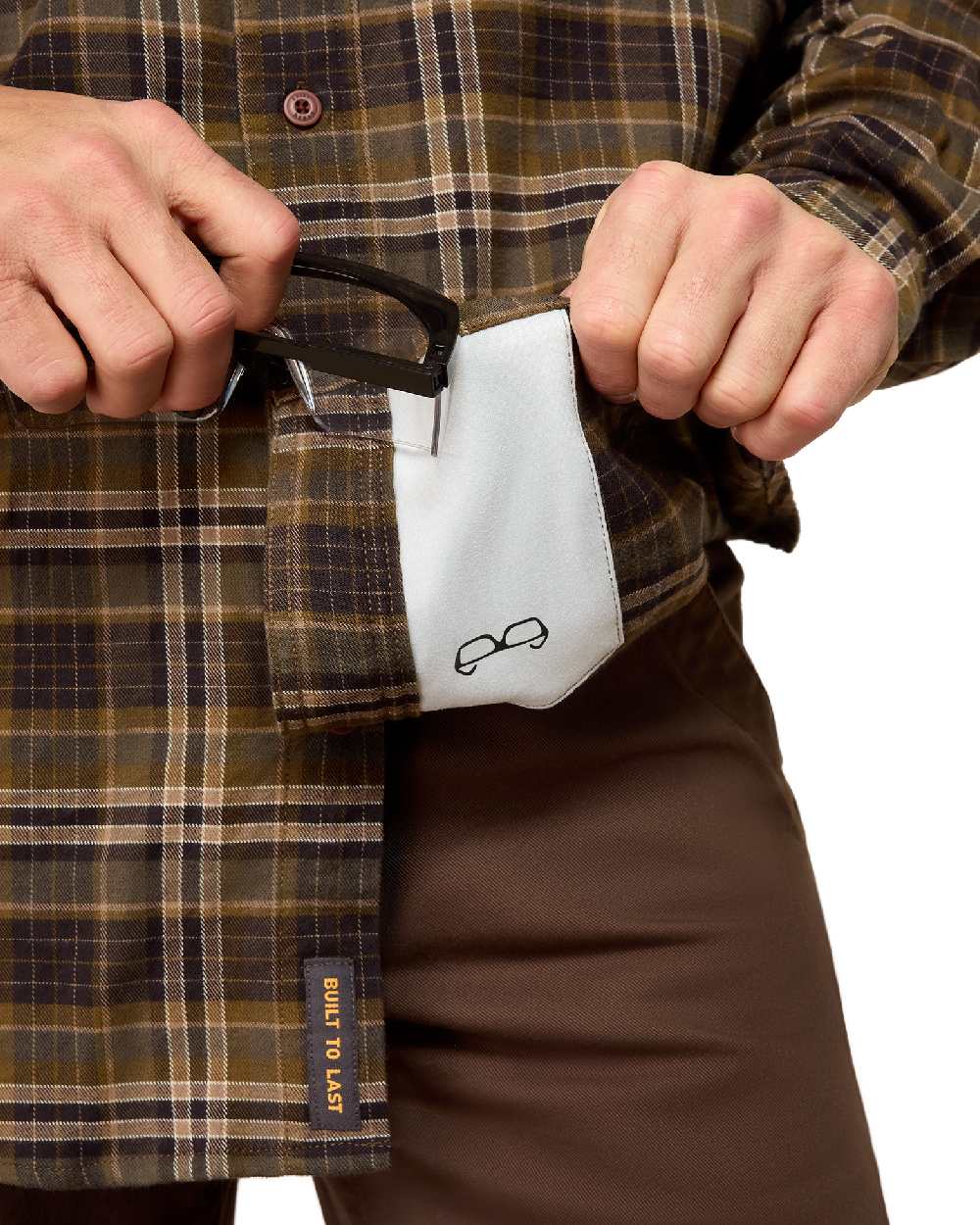 Earth coloured Ariat Mens Rebar Flannel Durastretch Long Sleeves Work Shirt on white background 