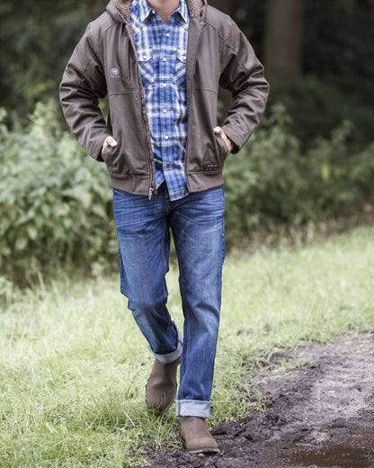 Java coloured Ariat Wexford Waterproof Boots on grass background 