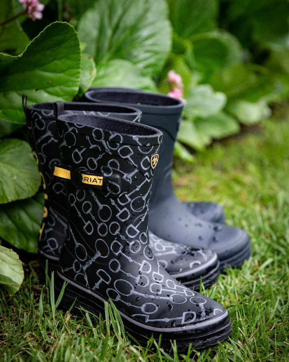 Black Bit Print coloured Ariat Womens Burford Wellington Boots on leafy background 