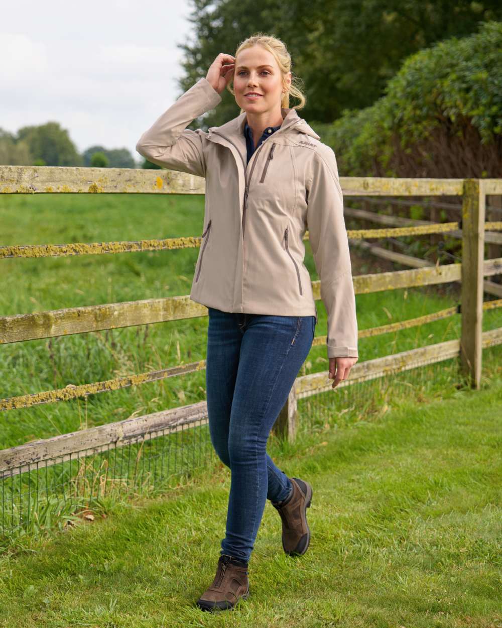 Cape Reed Coloured Ariat Womens Coastal Waterproof Jacket on outdoor background 