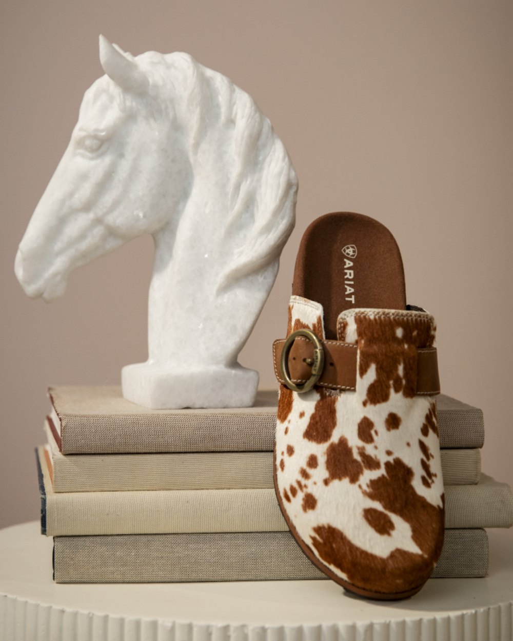 Cow Hair On coloured Ariat Womens Country Mules on indoor background 