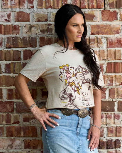 Natural Coloured Ariat Womens Keep Walkin Cowboy T-Shirt on wall background 