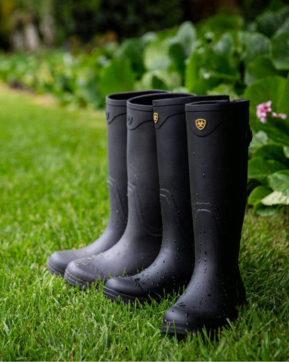 Black coloured Ariat Womens Kelmarsh Wellington Boots on grassy background 