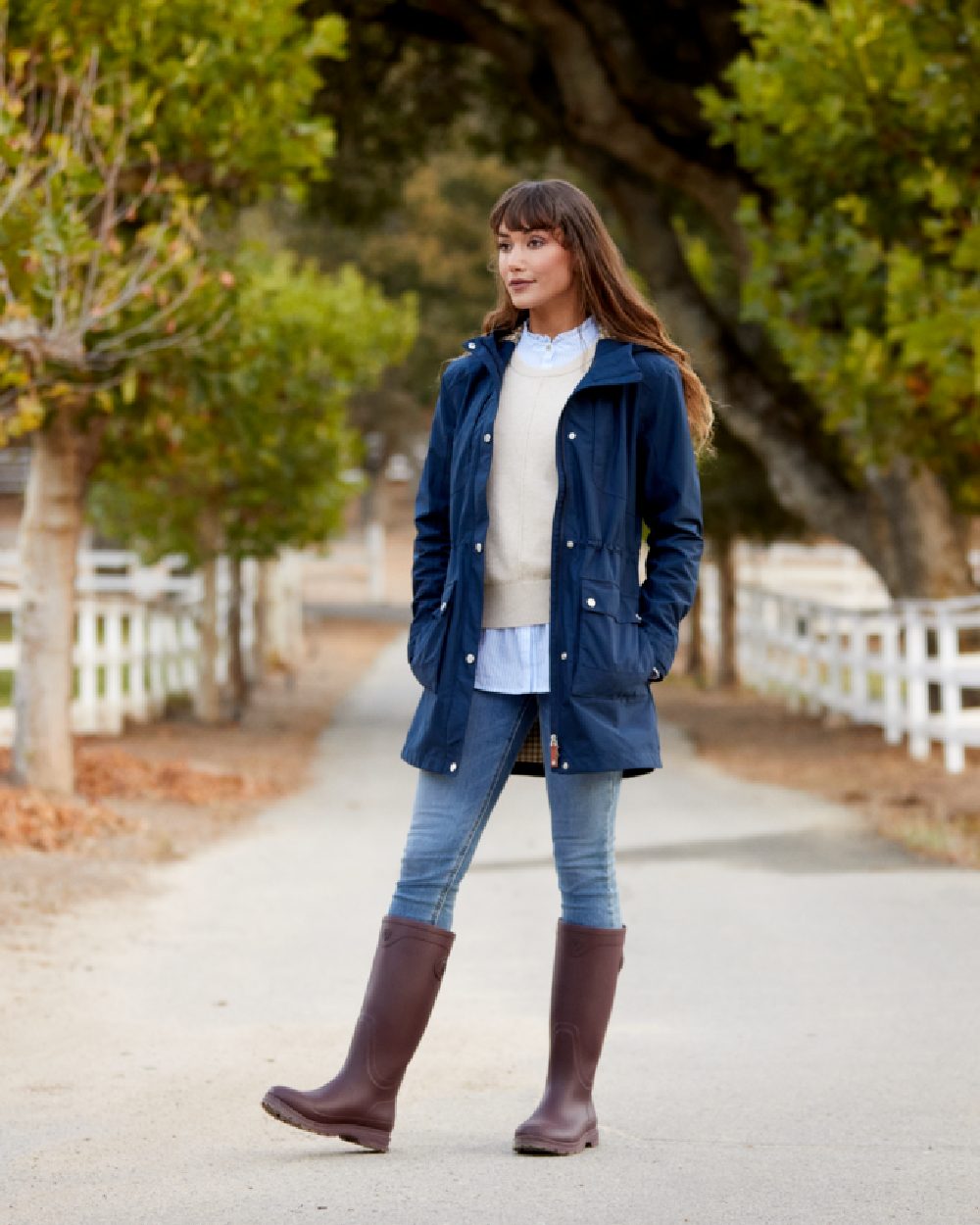 Maroon coloured Ariat Womens Kelmarsh Wellington Boots on Country walkway background 