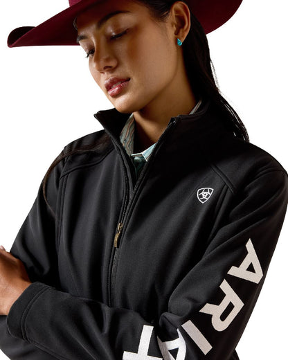 Black White coloured Ariat Womens Logo Softshell Jacket on white background 