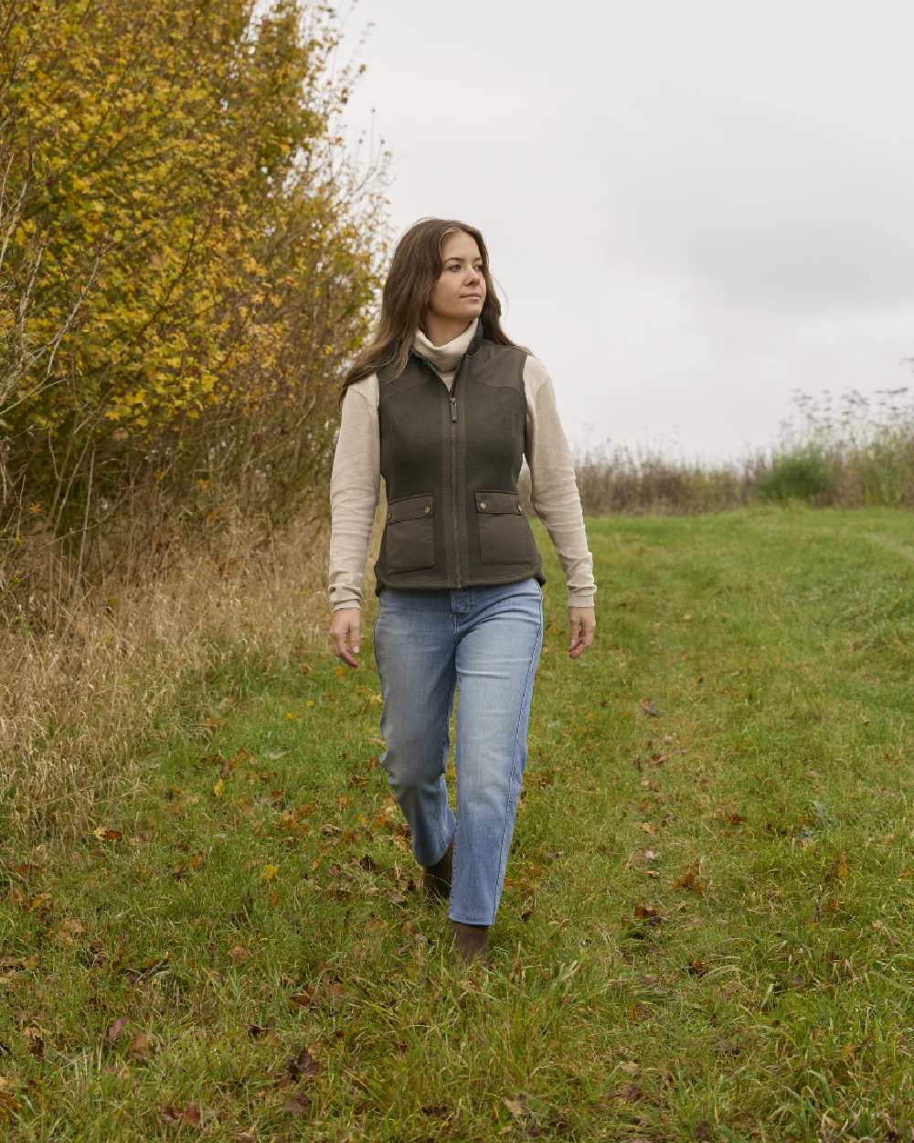 Earth coloured Ariat Womens Millbrae Gilet on field background 