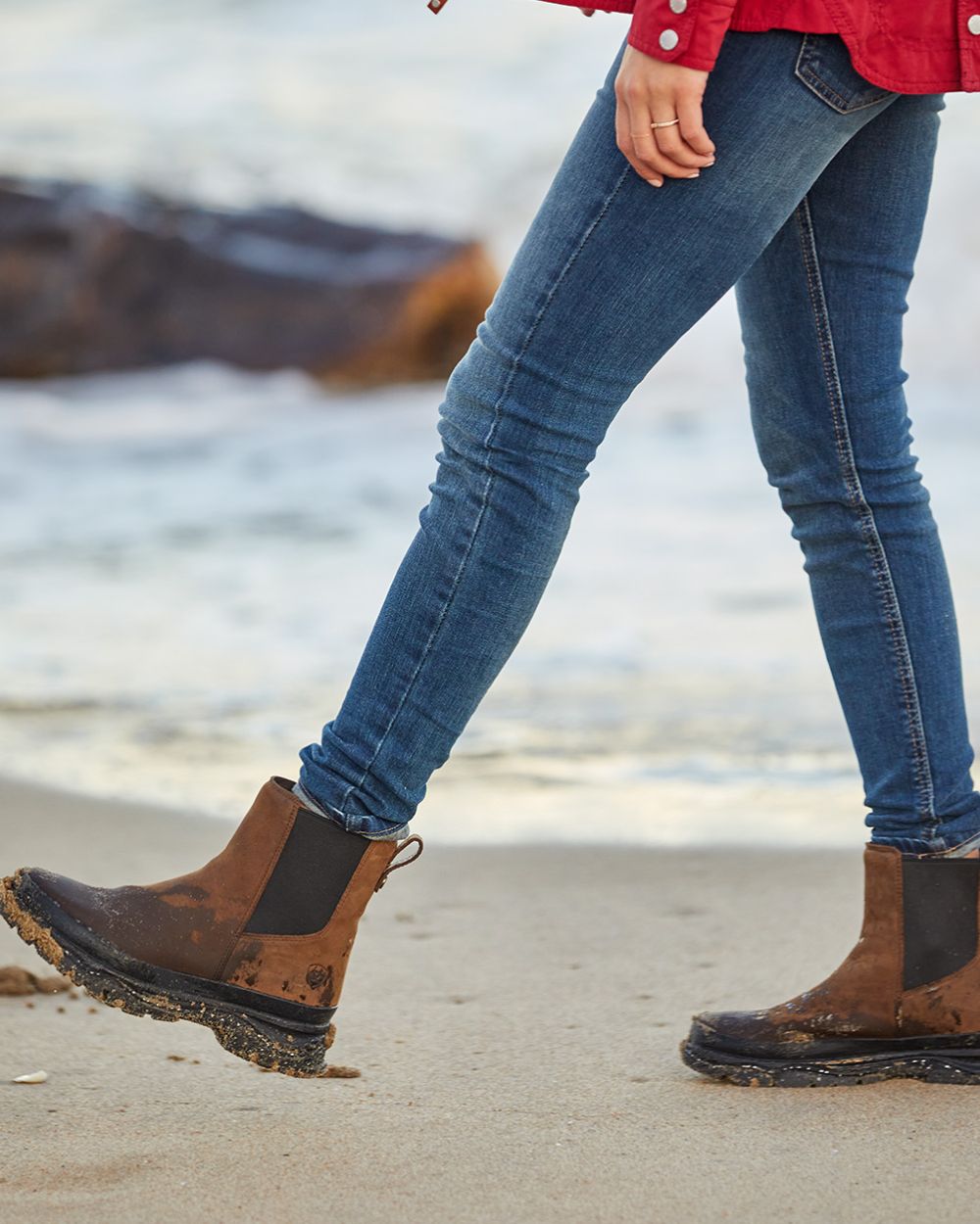 Oily Distressed Brown coloured Ariat Womens Moresby Waterproof Chelsea Boots on sea background 