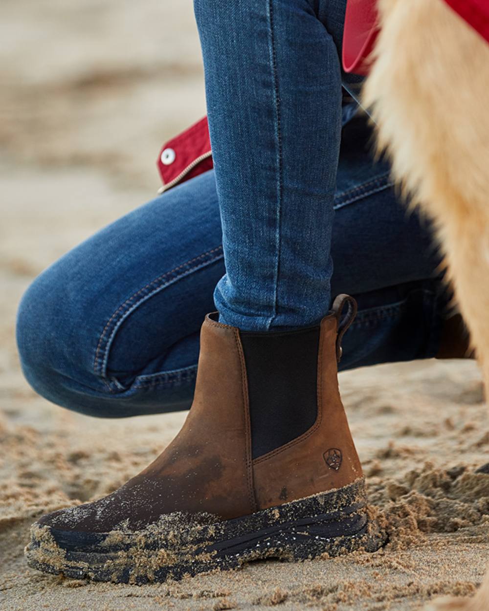 Oily Distressed Brown coloured Ariat Womens Moresby Waterproof Chelsea Boots on sand background 