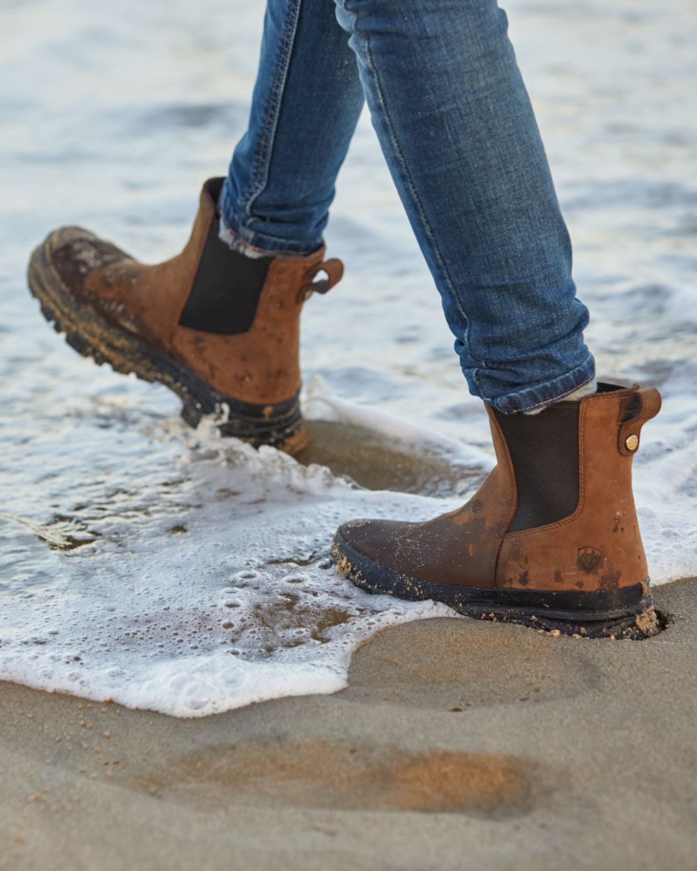 Oily Distressed Brown coloured Ariat Womens Moresby Waterproof Chelsea Boots on sea background 