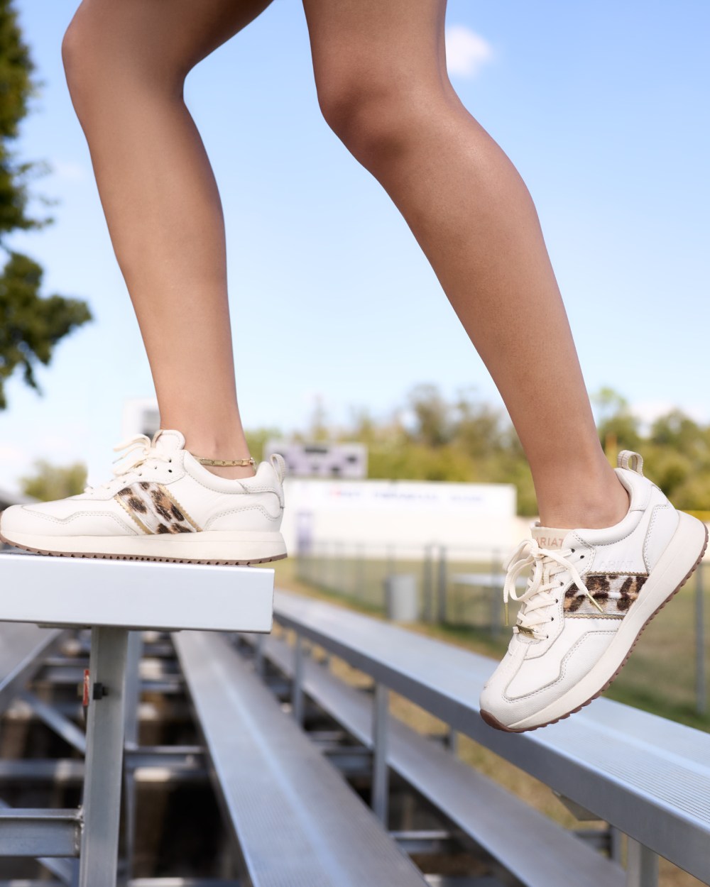 Bright Cream coloured Ariat Womens Ranch Runner Shoes on outdoor background 
