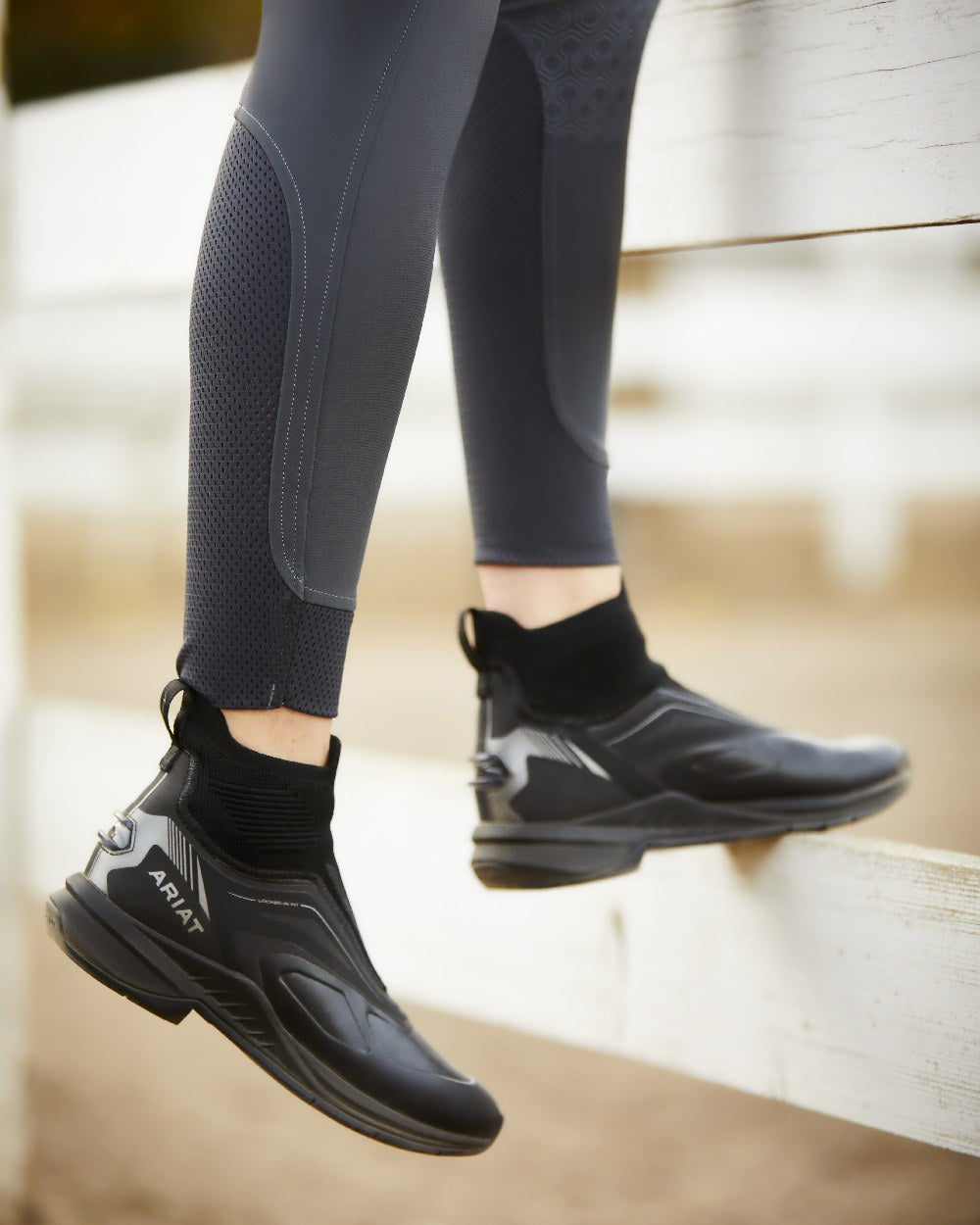 Black coloured Ariat Womens Halo Denim Full Seat Breech on wooden background 