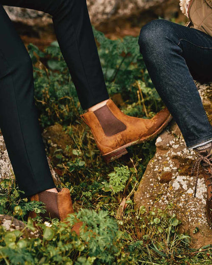 Weathered Brown coloured Ariat Womens Wexford Waterproof Boots on grass background 