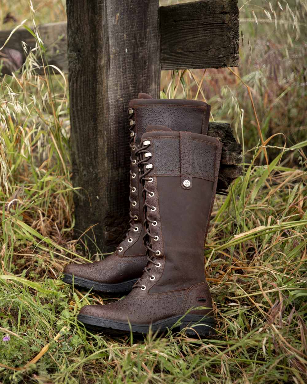 Tobacco Brown coloured Ariat Wythburn Waterproof Boots on field background 
