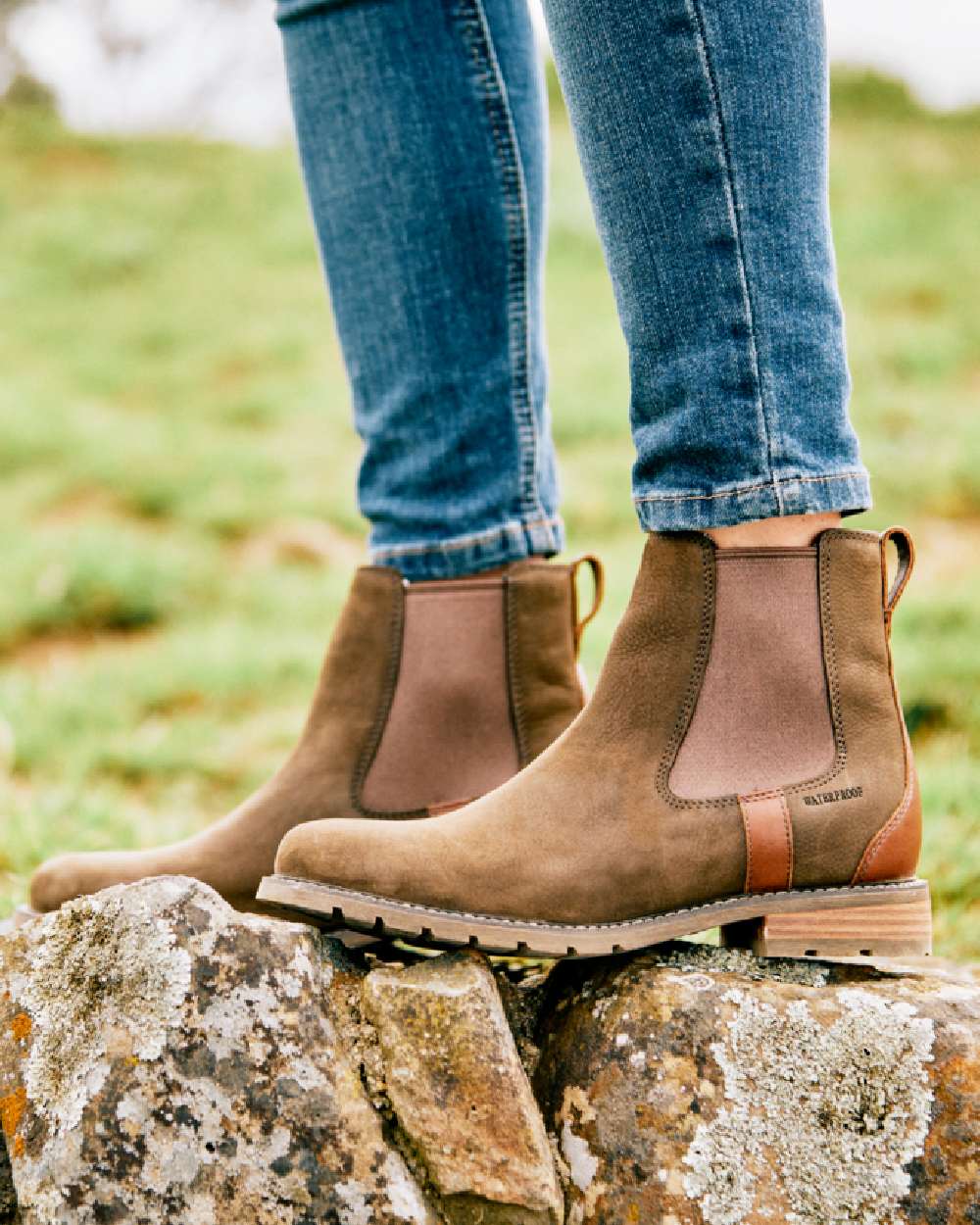 Java coloured Ariat Womens Wexford Waterproof Boots on grass background 