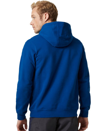 Deep Fjord Coloured Helly Hansen Mens Logo Hoodie On A White Background 