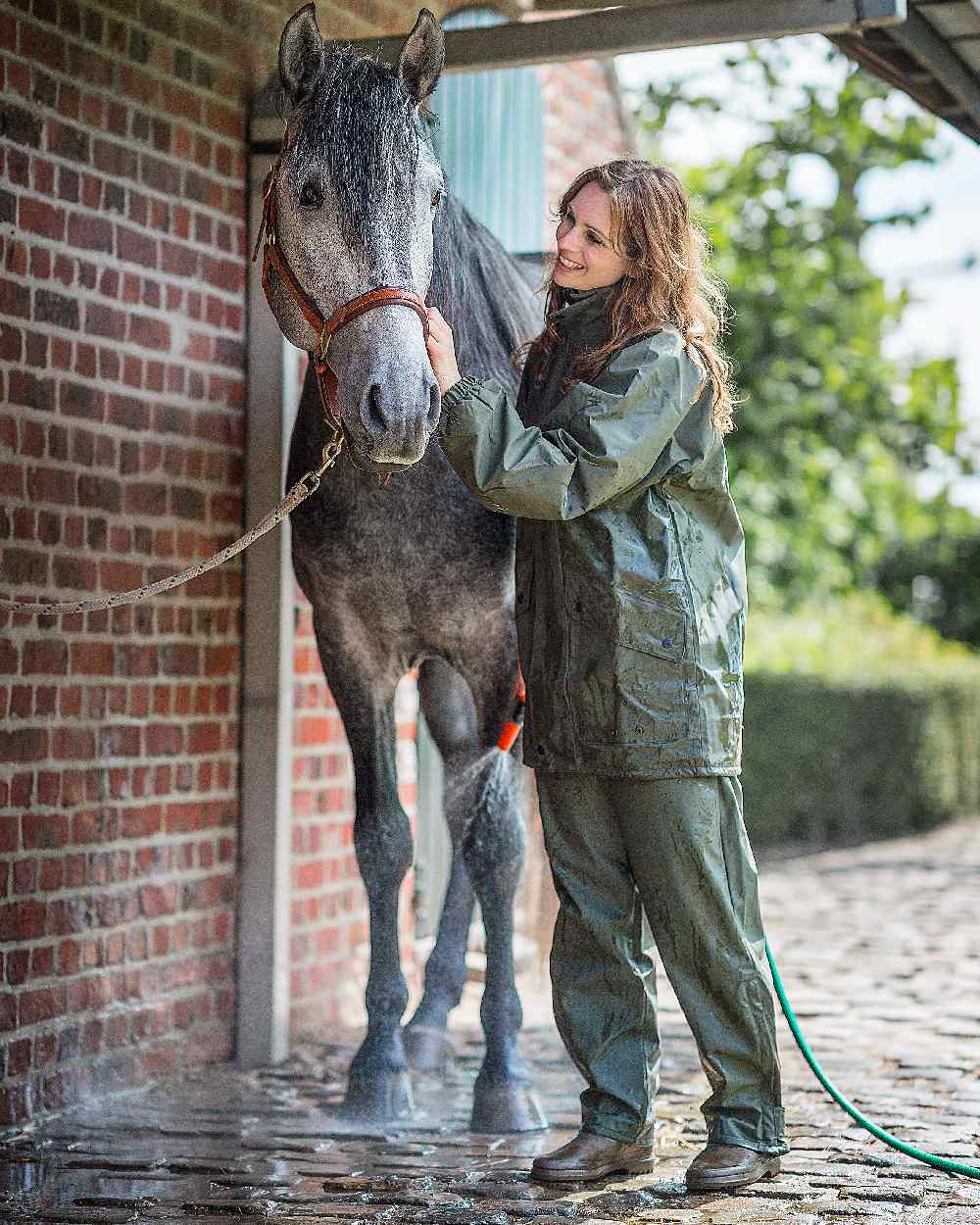 Khaki Coloured Baleno Arras Rain Jacket on stable background 