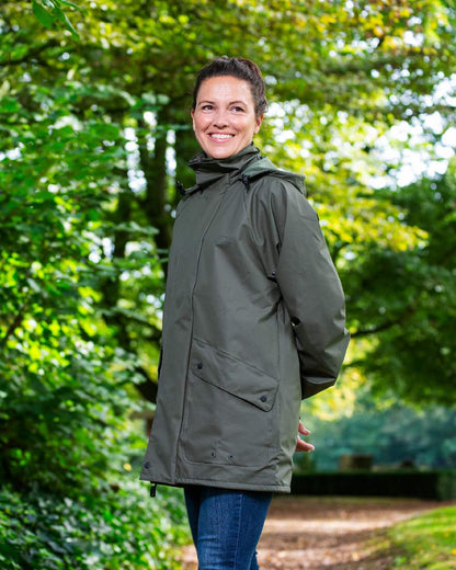 Khaki Coloured Baleno Arras Rain Jacket on forest background 