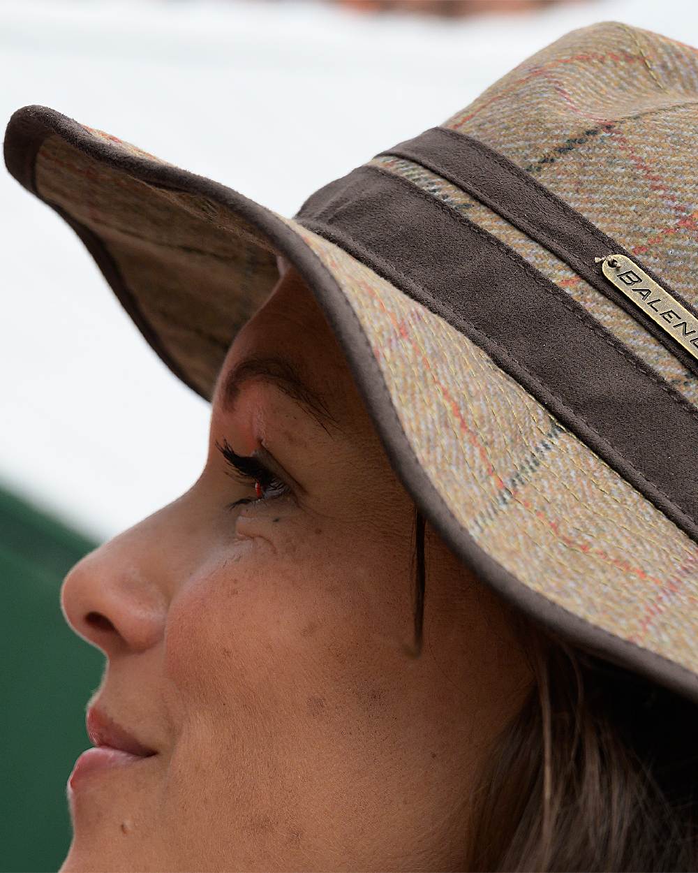 Check Khaki Coloured Baleno Caitlin Printed Tweed Hat on blurry background 