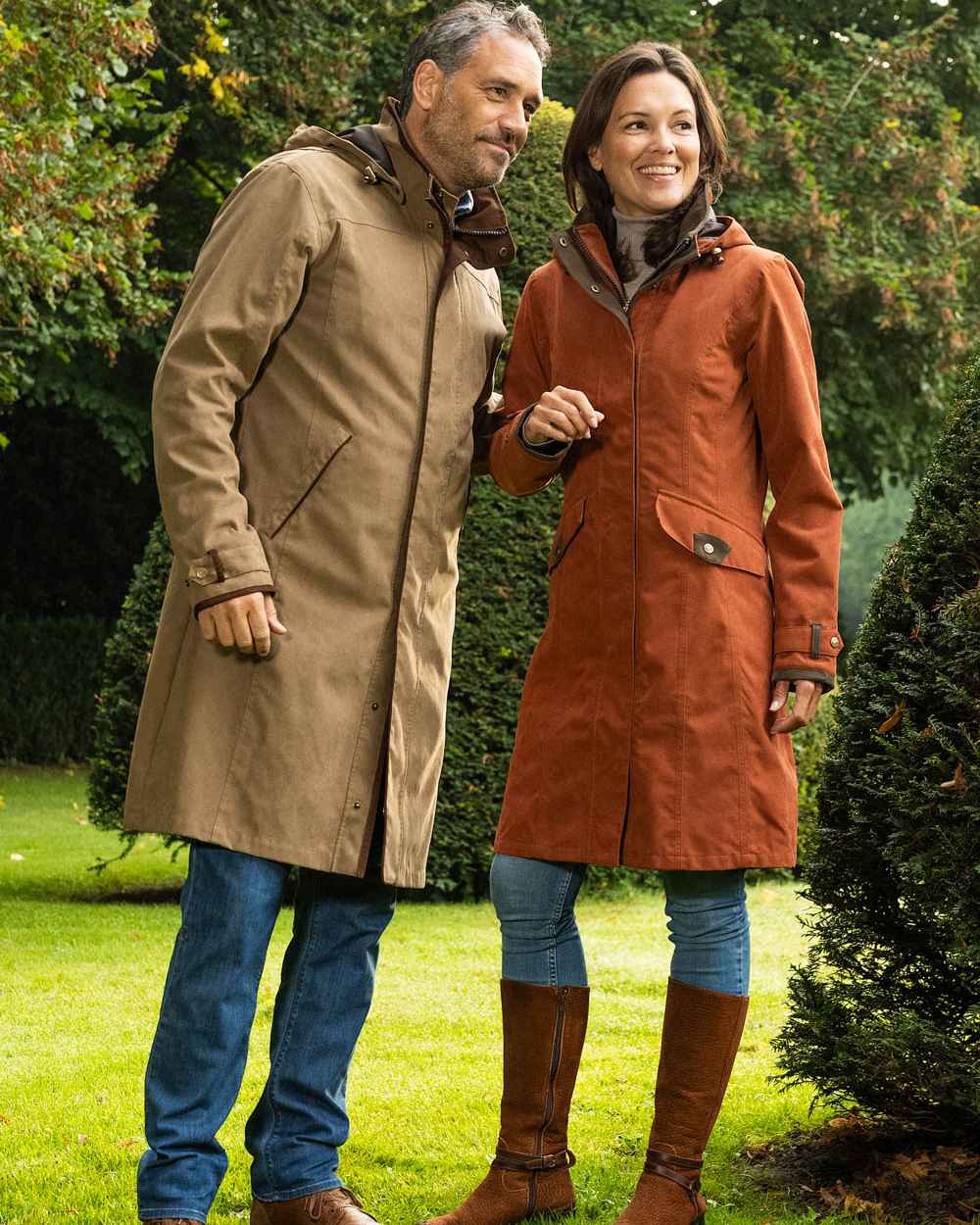Terracotta Coloured Baleno Chelsea Mid Length Coat on garden background 