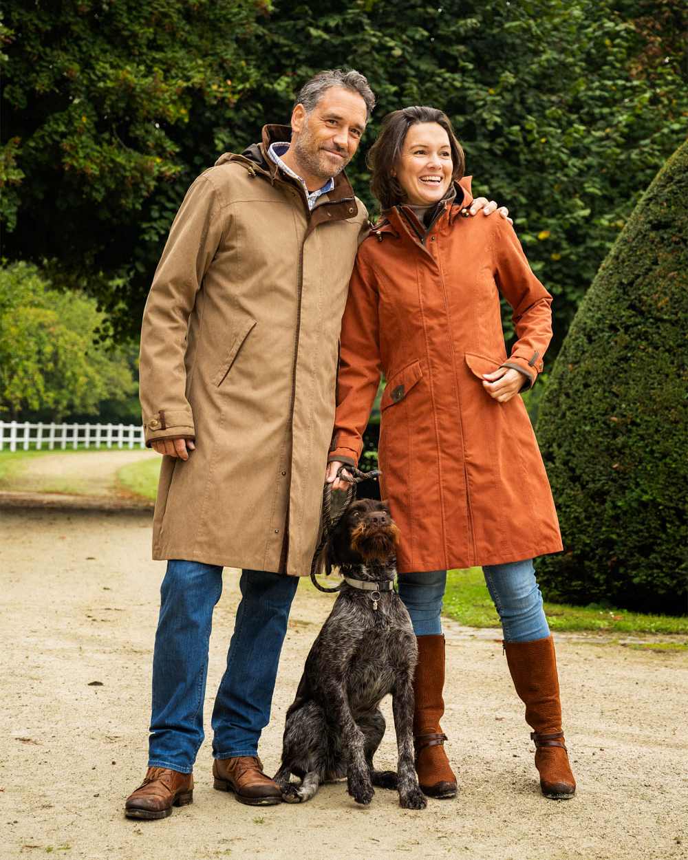 Terracotta Coloured Baleno Chelsea Mid Length Coat on garden background 