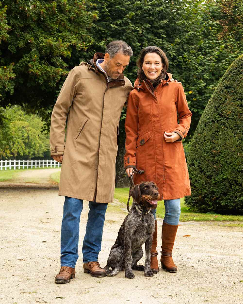 Terracotta Coloured Baleno Chelsea Mid Length Coat on garden background 