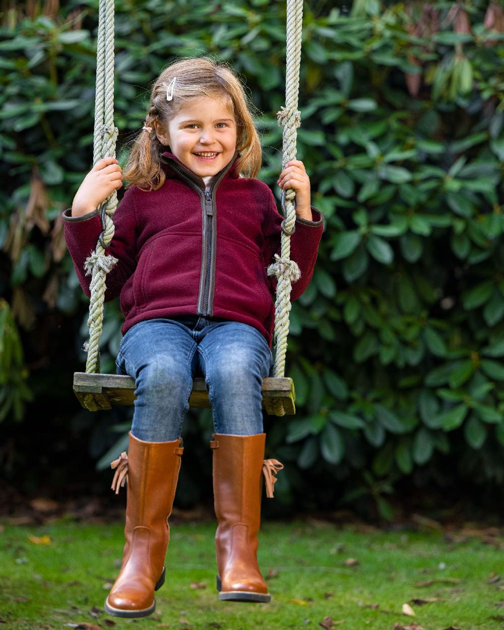 Burgundy Coloured Baleno Kids Cody Fleece on park background 